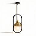 Black and gold pendant light with glass shade for kitchen or dining room